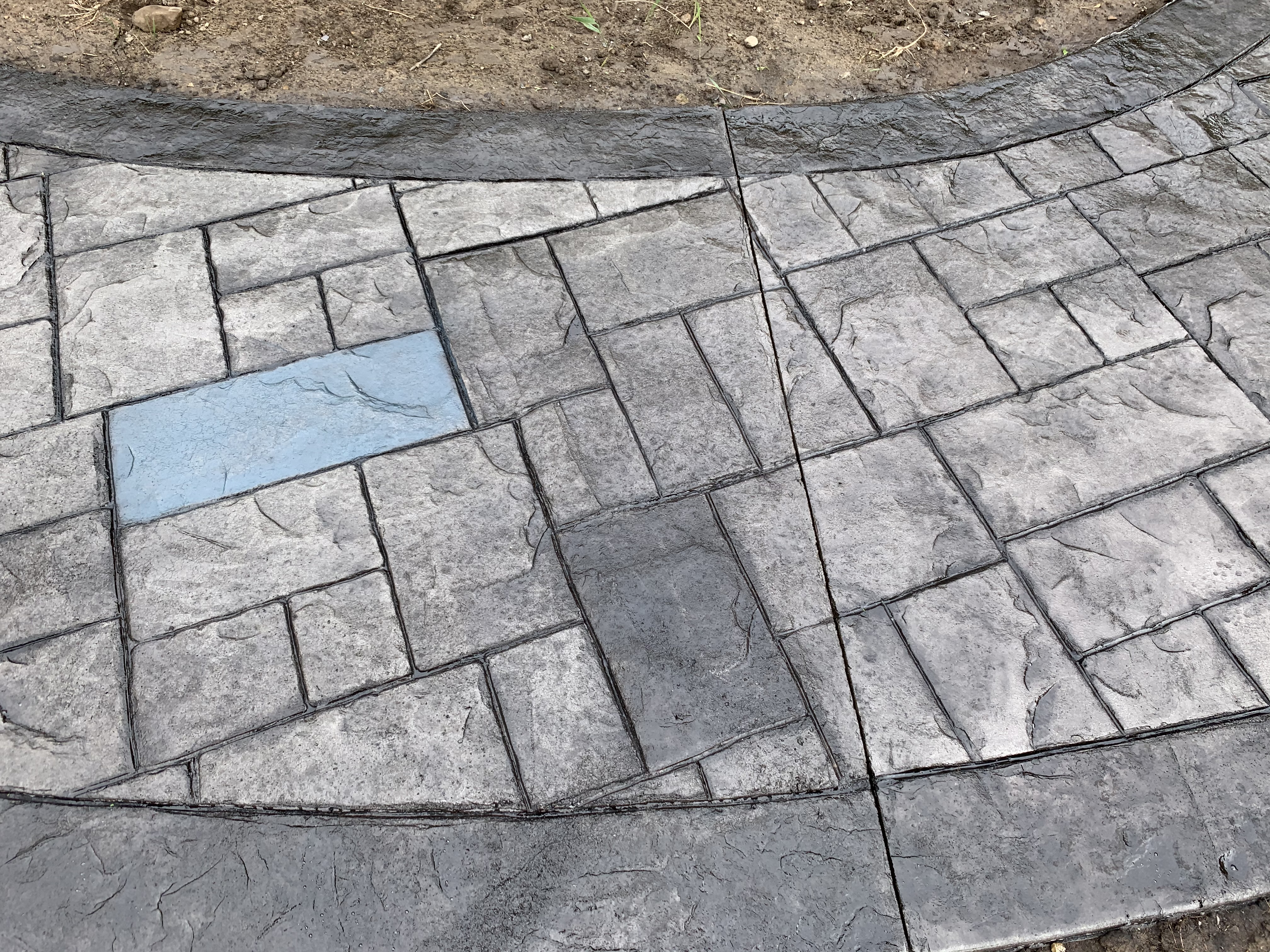 Ashlar stamped concrete pattern close-up — Flaska residence